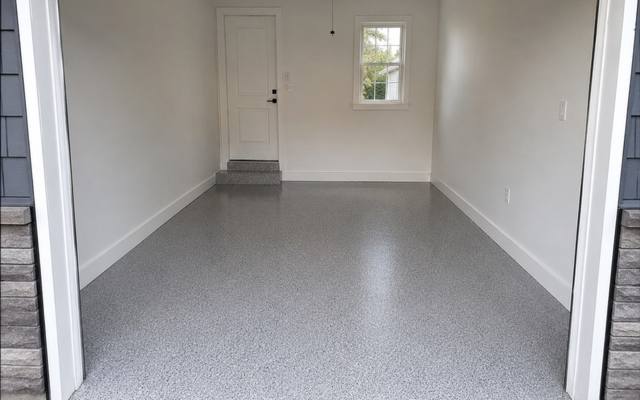 Grey flake epoxy floor in a single garage in Cambridge